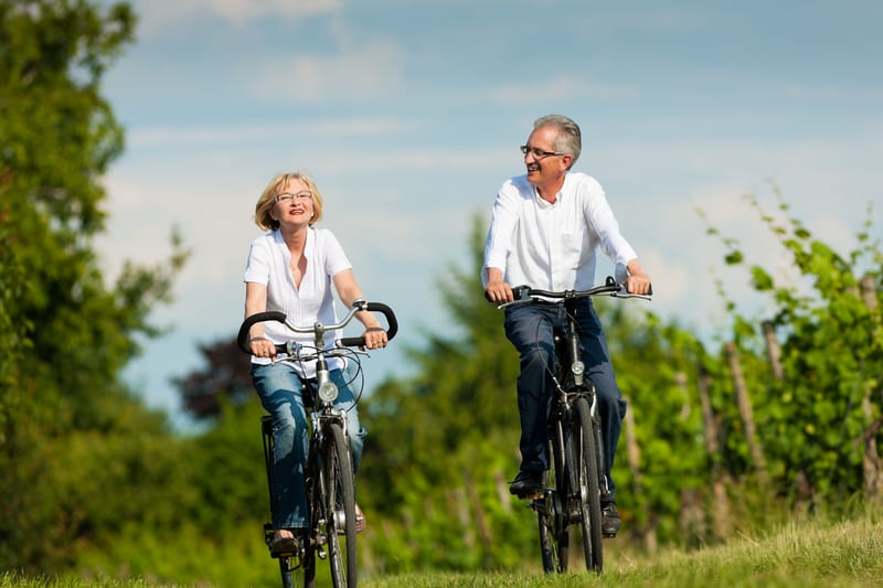 happy-senior-couple-cycling-outdoors-in-summer | PHC Tennessee